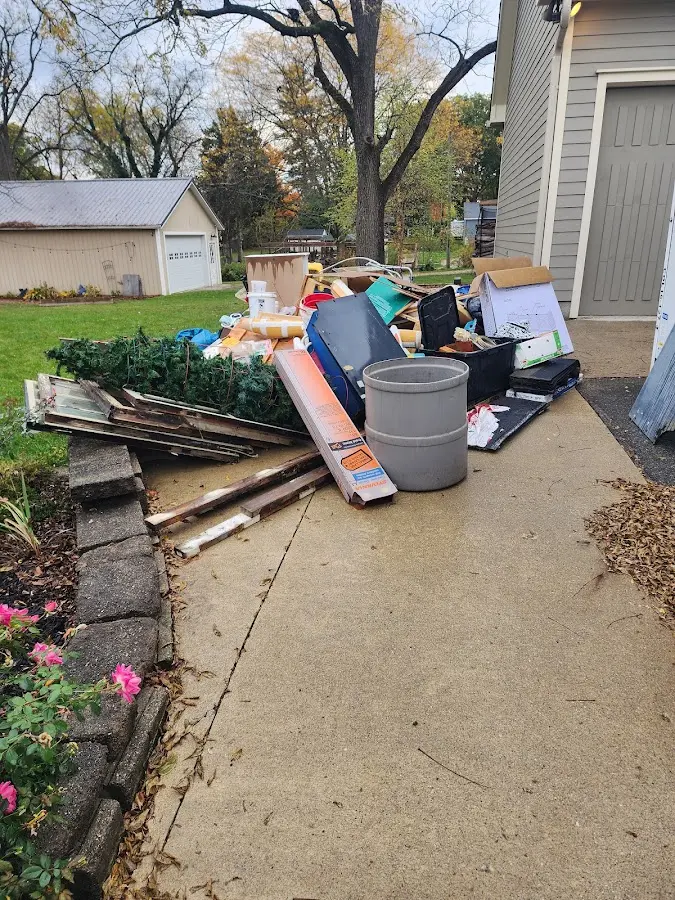 Dumpster being loaded with debris for Commercial Dumpster Rental in Lincolnwood